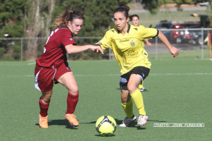 Angie Rassias goes past Alicia McKillen