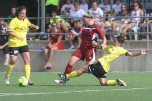 Bakopoulos (right) tackles Erin Doughty. Photo: John Punshon